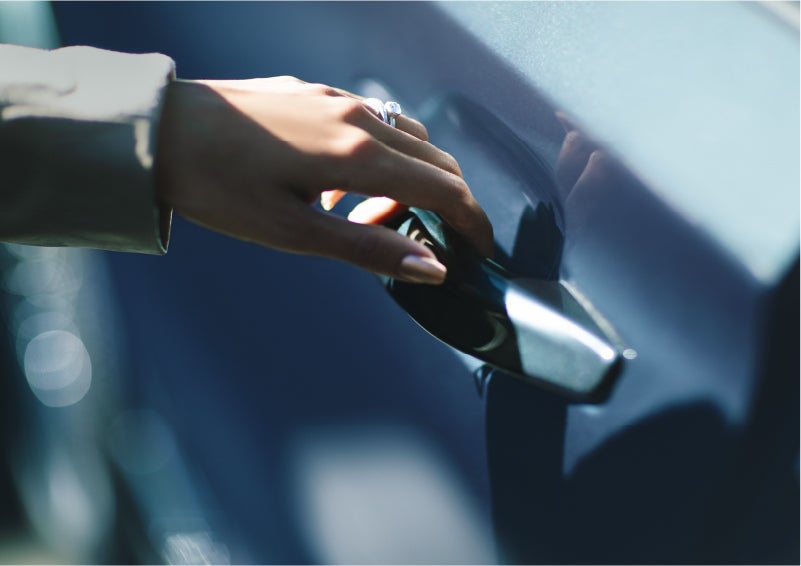 A hand gracefully grips the Light Touch Handle of a 2023 Lincoln Aviator® SUV to demonstrate its ease of use | Duncan Lincoln in Blacksburg VA